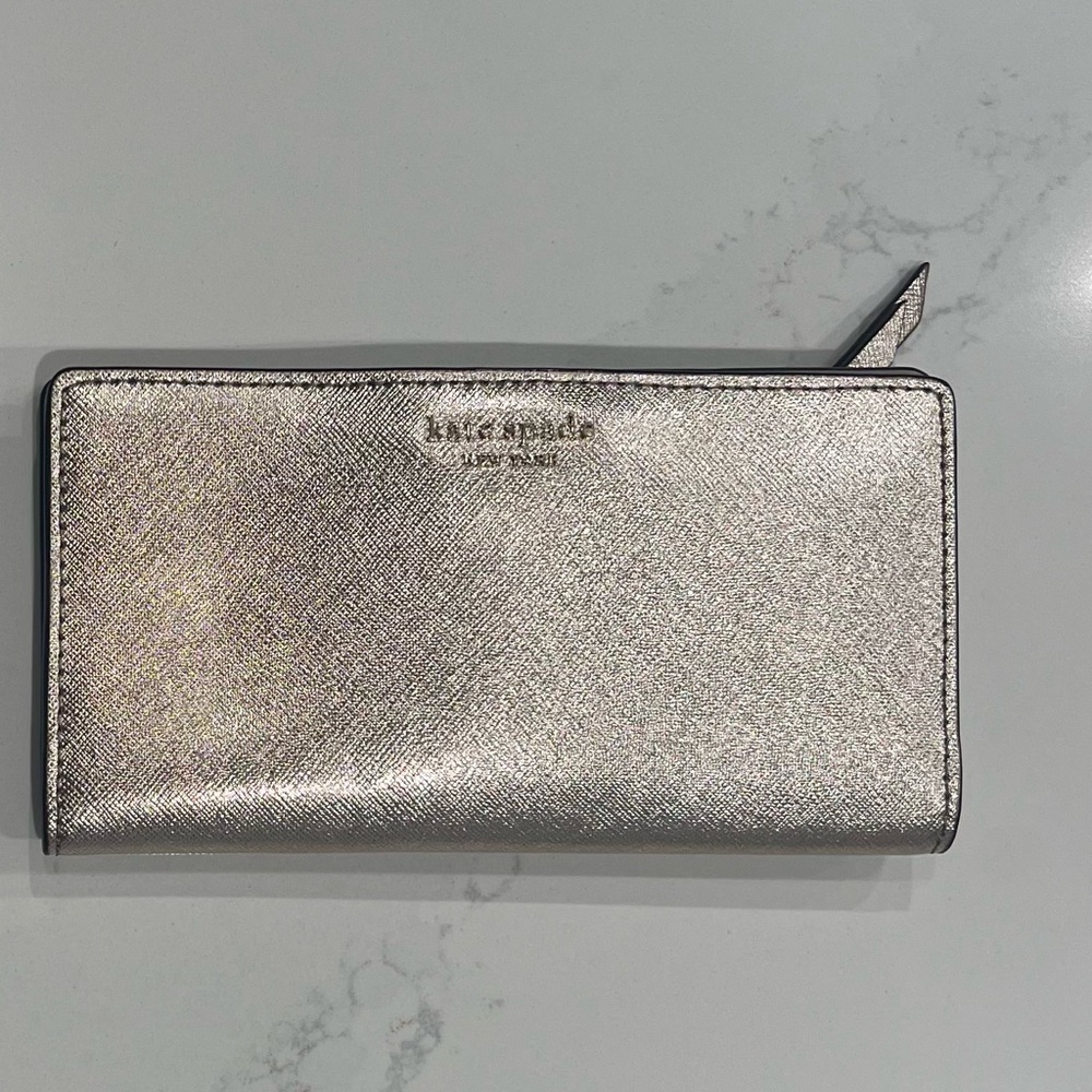 Kate Spade bifold wallet in metallic champagne